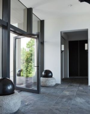 braithwait-window-modern black door windows stone tile floor.jpg